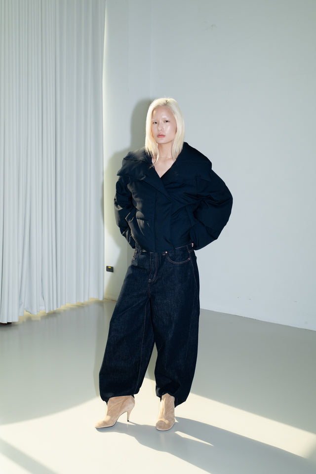 Dark blue quilted down jacket with a large lapel.